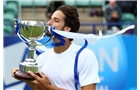 EASTBOURNE, ENGLAND - JUNE 22:  Feliciano Lopez of Spain poses with the trophy after defeating Gilles Simon of France during his men's singles final match on day eight of the AEGON International tennis tournament at Devonshire Park on June 22, 2013 in Eastbourne, England.  (Photo by Jan Kruger/Getty Images)